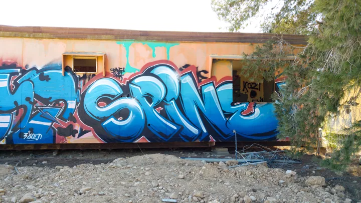 Tlalim · blue letters