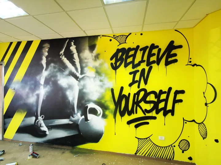 Gym · yellow and black mural