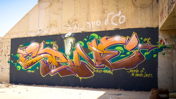 Lettering beneath a bridge