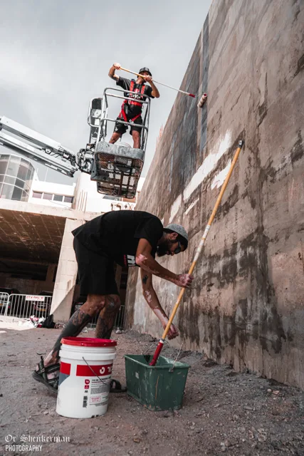 Preparing the wall with rollers and a lift