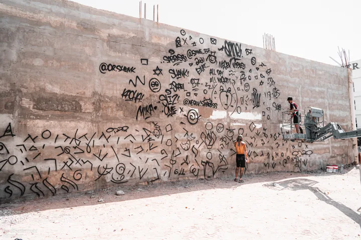 Initial markings across the wall