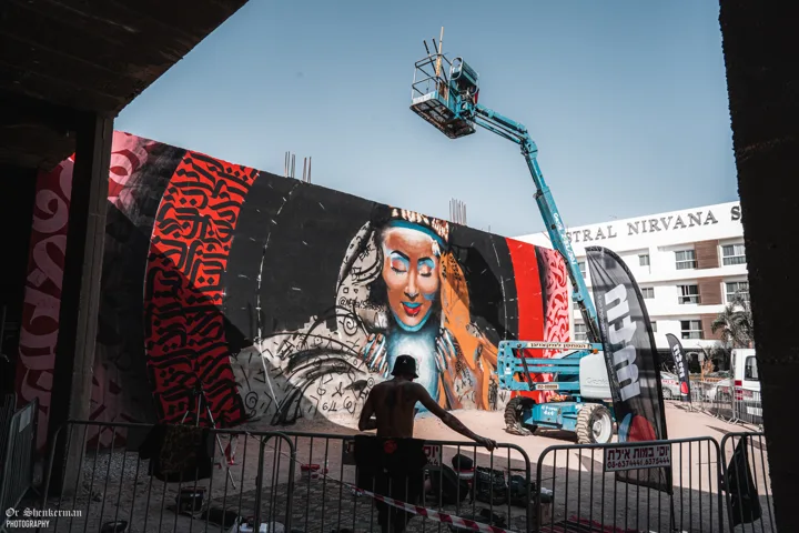 The mural in progress with the access lift