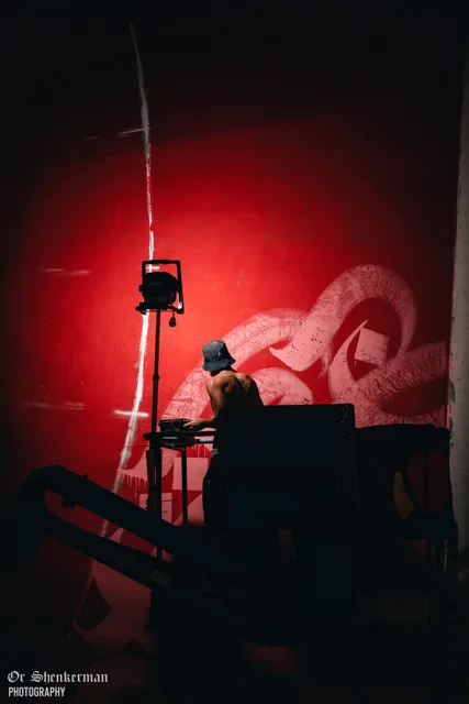 Painting the pink lettering at night