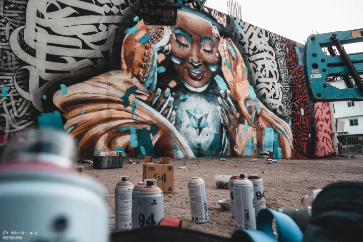 Mural with painting materials in the foreground