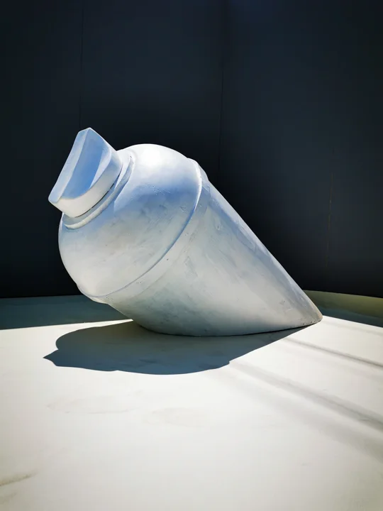 The white spray-can sculpture before its final painted finish.